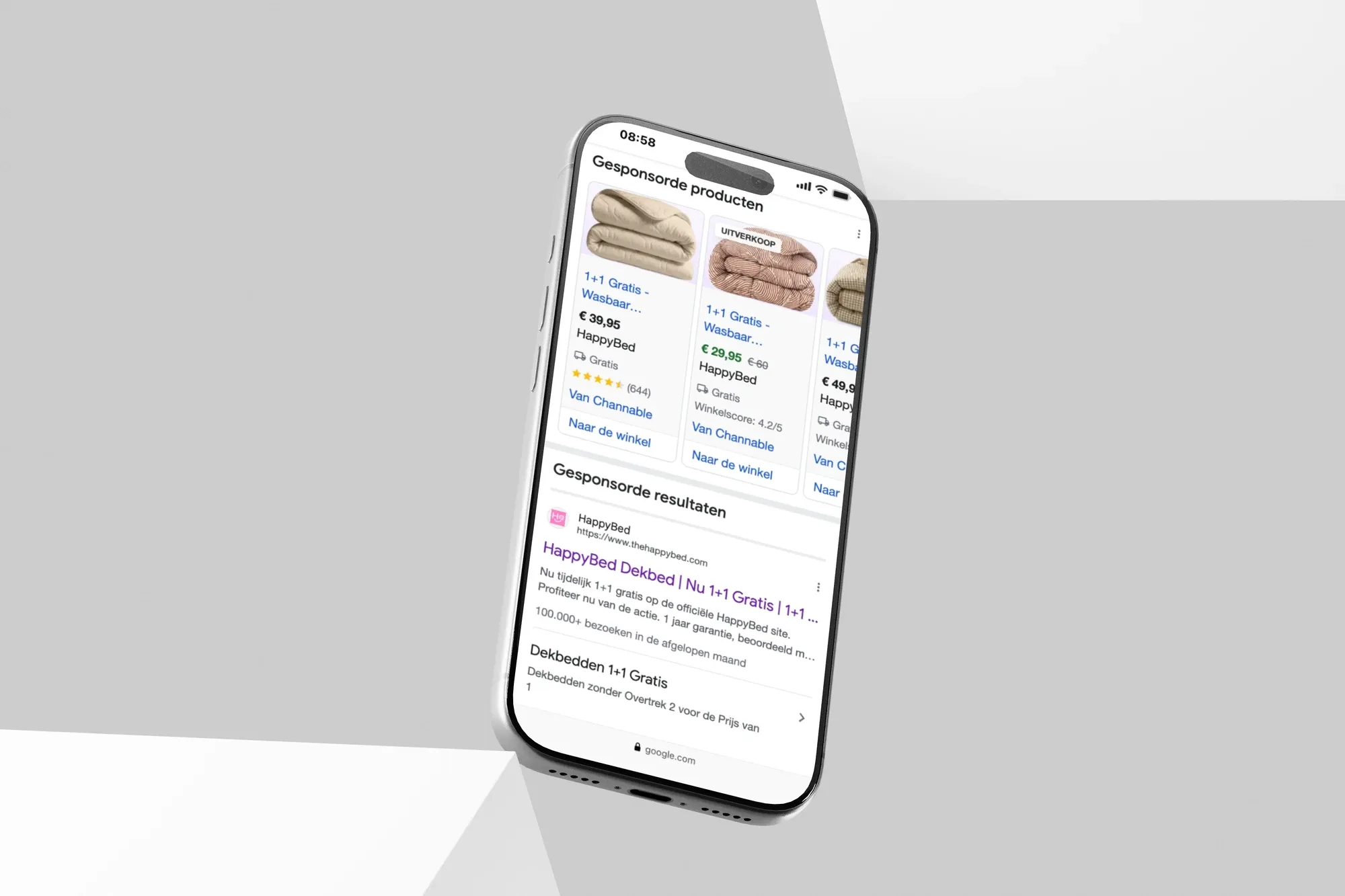 Google Shopping-advertenties van HappyBed voor dekbedden op een telefoon, met de actie 1+1 gratis